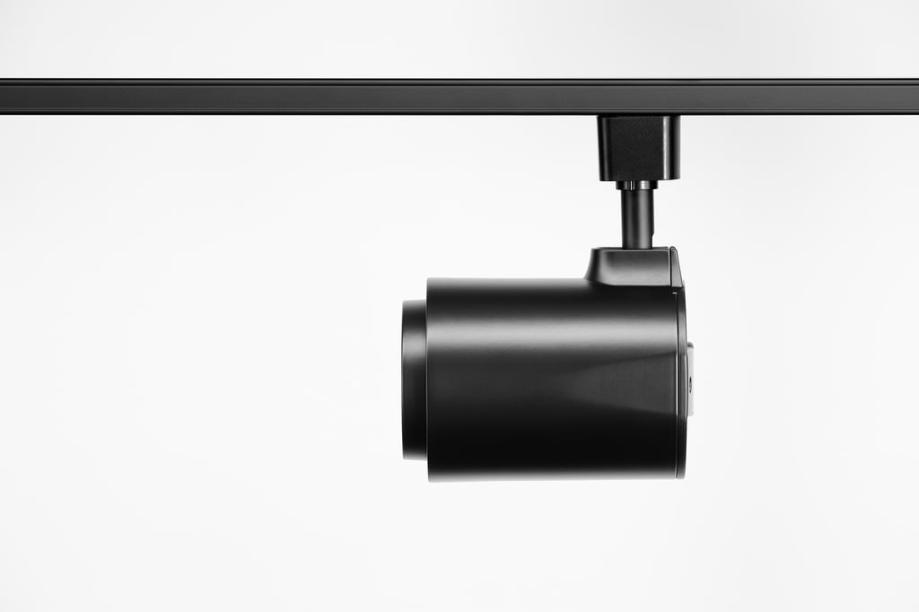 Professional track lighting heads with controlled beams installed in New York interior