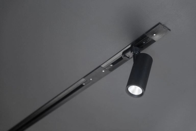 Track lights arranged for flexible illumination in a California interior space